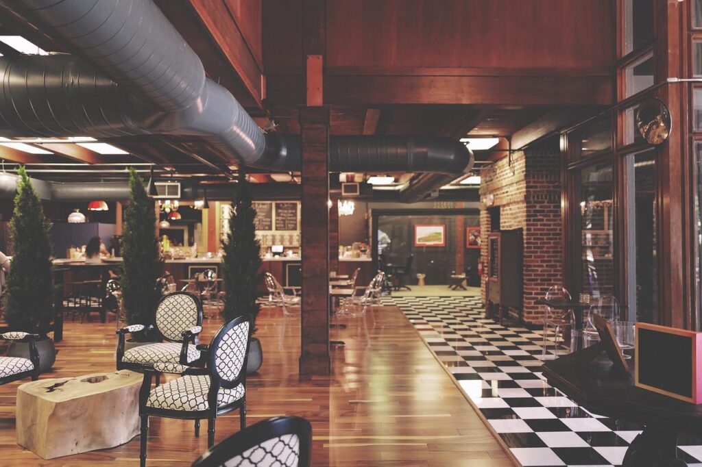 hotel website blog interior of a restaurant with a black-and-white checkered floor and wooden interior
