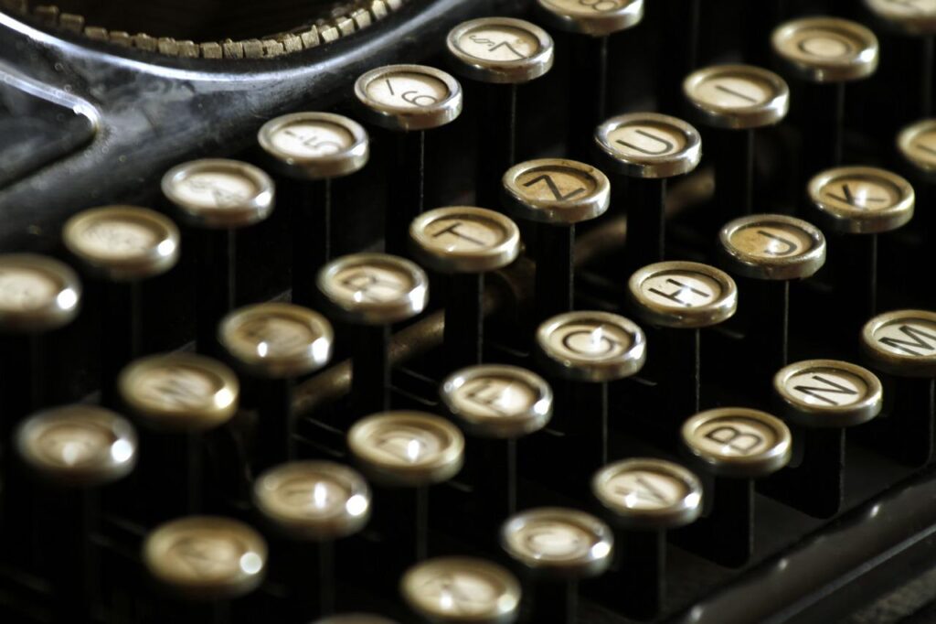 close-up of keys in typewriter used to write corporate video script